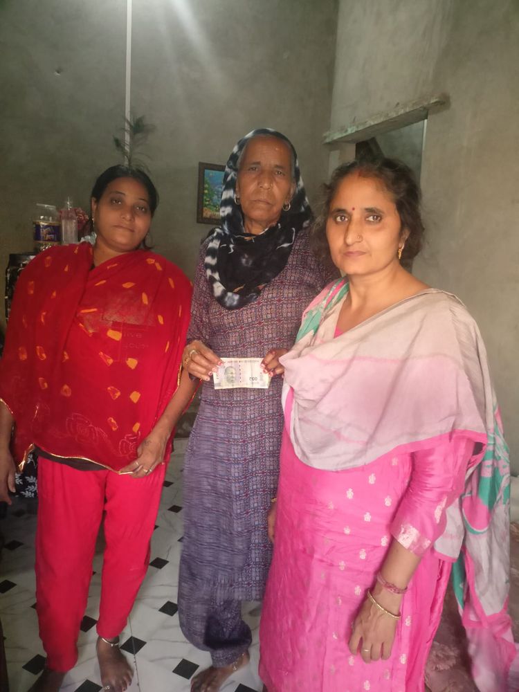 Vaidikam Foundation team providing direct financial support to a beneficiary